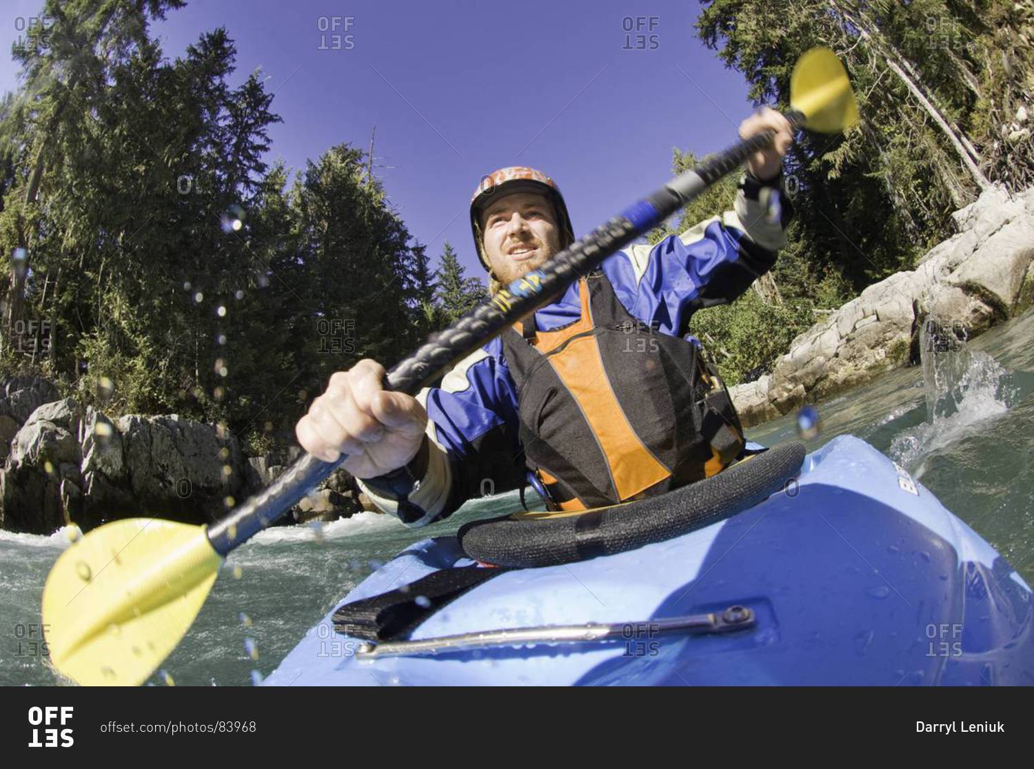 Man kayaking rough waters