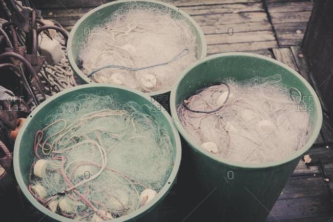 Germany, Mecklenburg-Western Pomerania, Ruegen, Fishing nets in buckets in winter