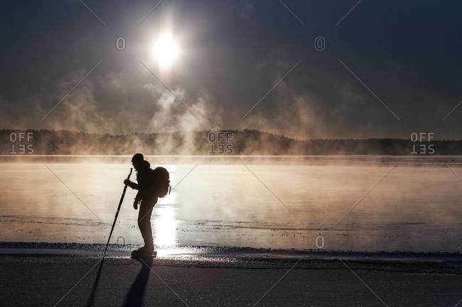 Silhouette of a long-distance skater in Skeppsbron, Sweden
