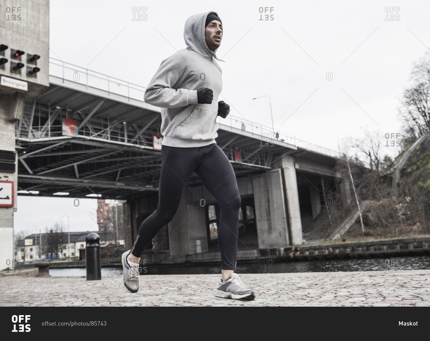 Full length of man jogging on street