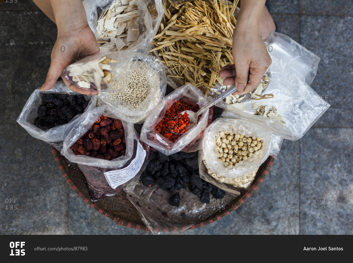 A street side store selling various herbs and roots used in traditional medicine on Lan Ong street in Hanoi's Old Quarter, Vietnam.