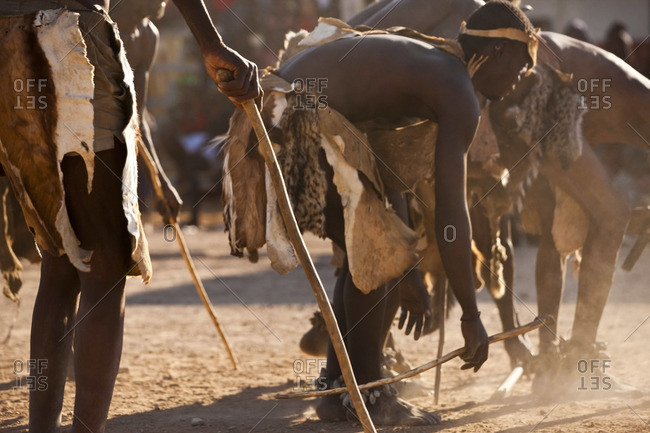 Tribesmen holding sticks - Offset Collection