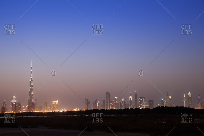 Dubai skyline at dusk, second building on the left is Burj Khalifa, tallest building in the world