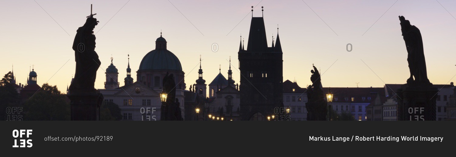 Silhouette of Statues on Charles Bridge, Dome of St. Francis Church and Old Town Bridge Tower, Prague, Bohemia, Czech Republic, Europe