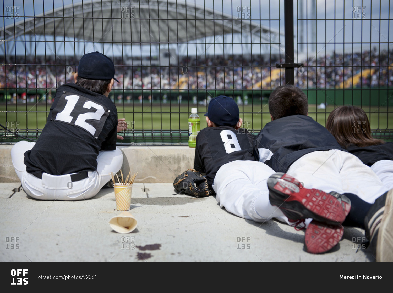Children watching a game at a baseball field