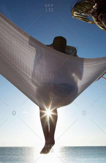 Woman in a hammock on the beach, Florida, United States of America, North America