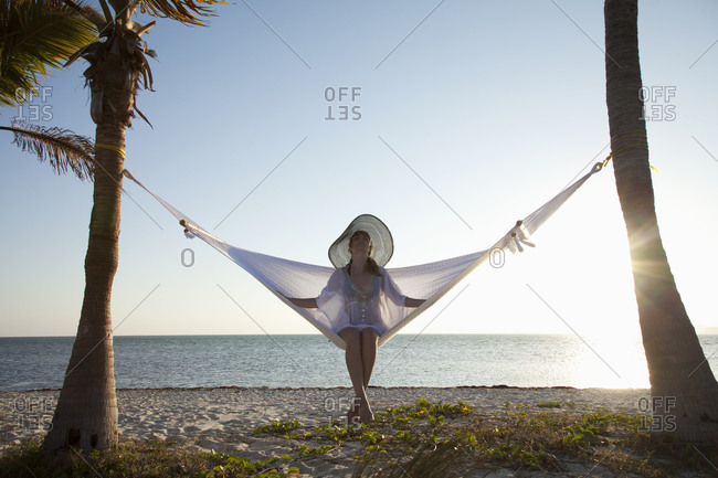 Woman in a hammock on the beach, Florida, United States of America, North America