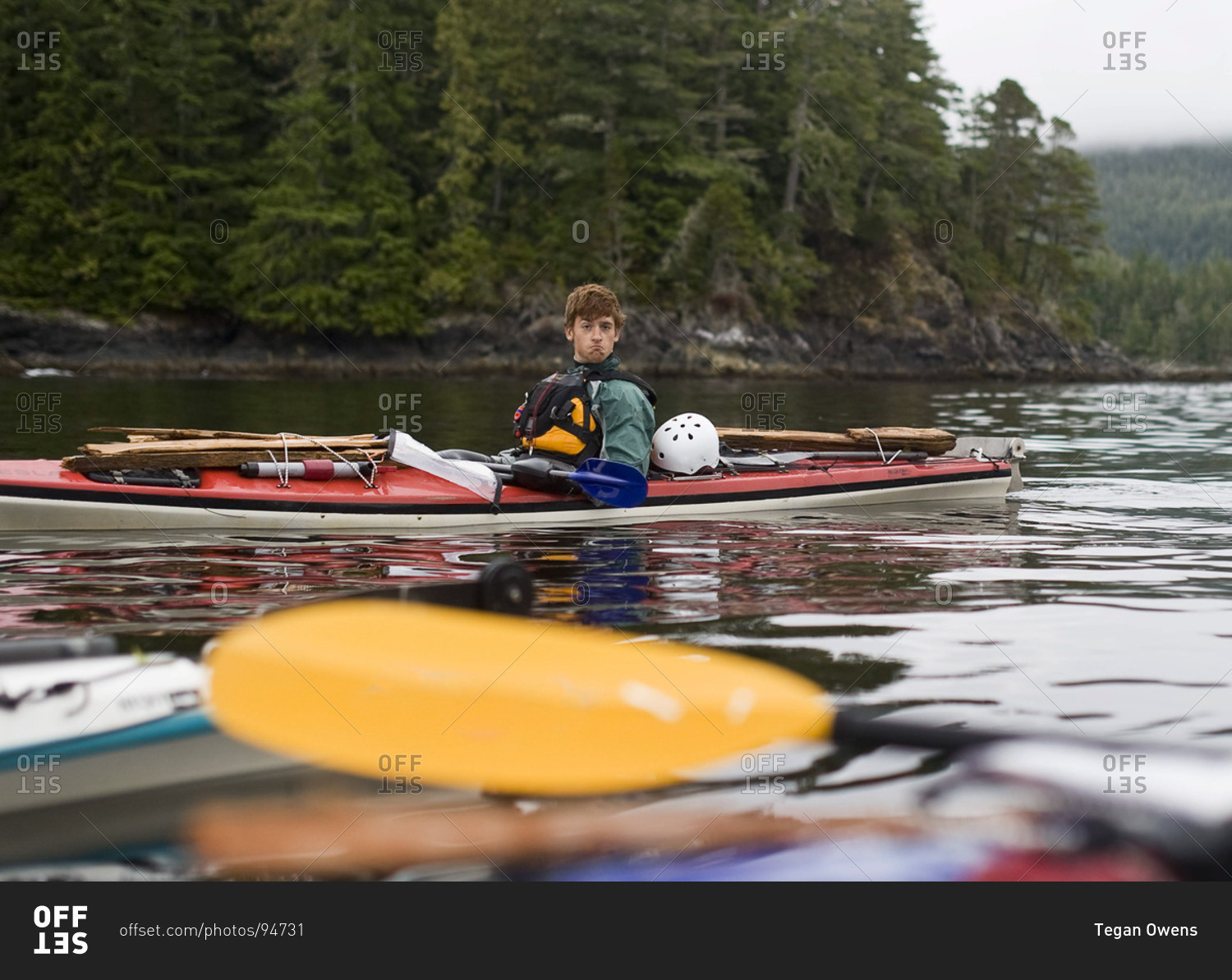 A man makes a face while kayaking