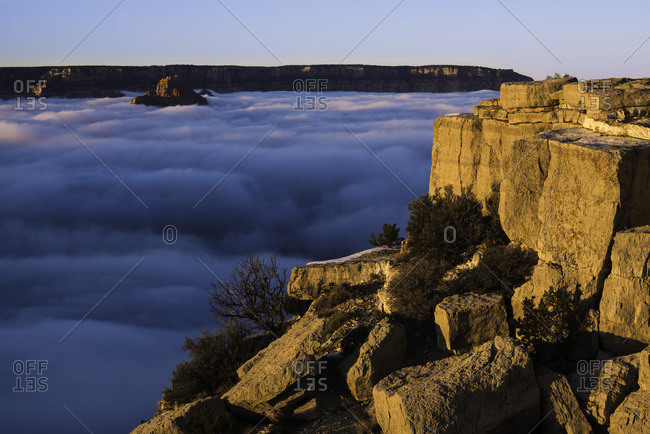 In what is known as a temperature inversion, clouds fill the Grand Canyon when cold air below the rim is trapped by warmer air above.