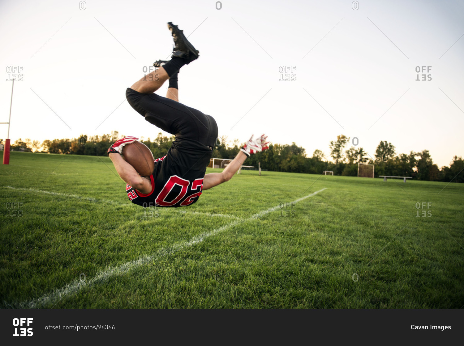 Football player doing a back flip