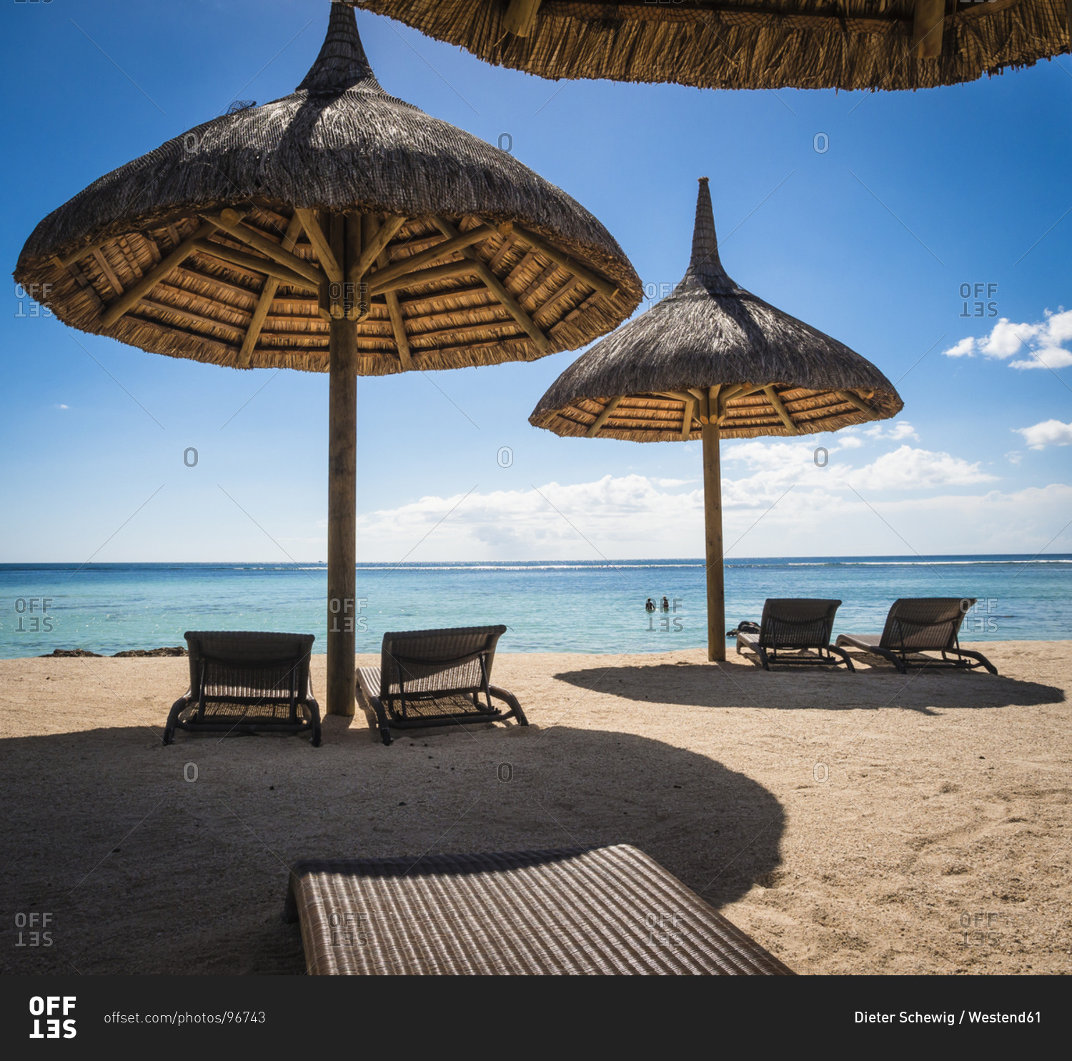 Mauritius, sunshades and beach chairs in front of the sea