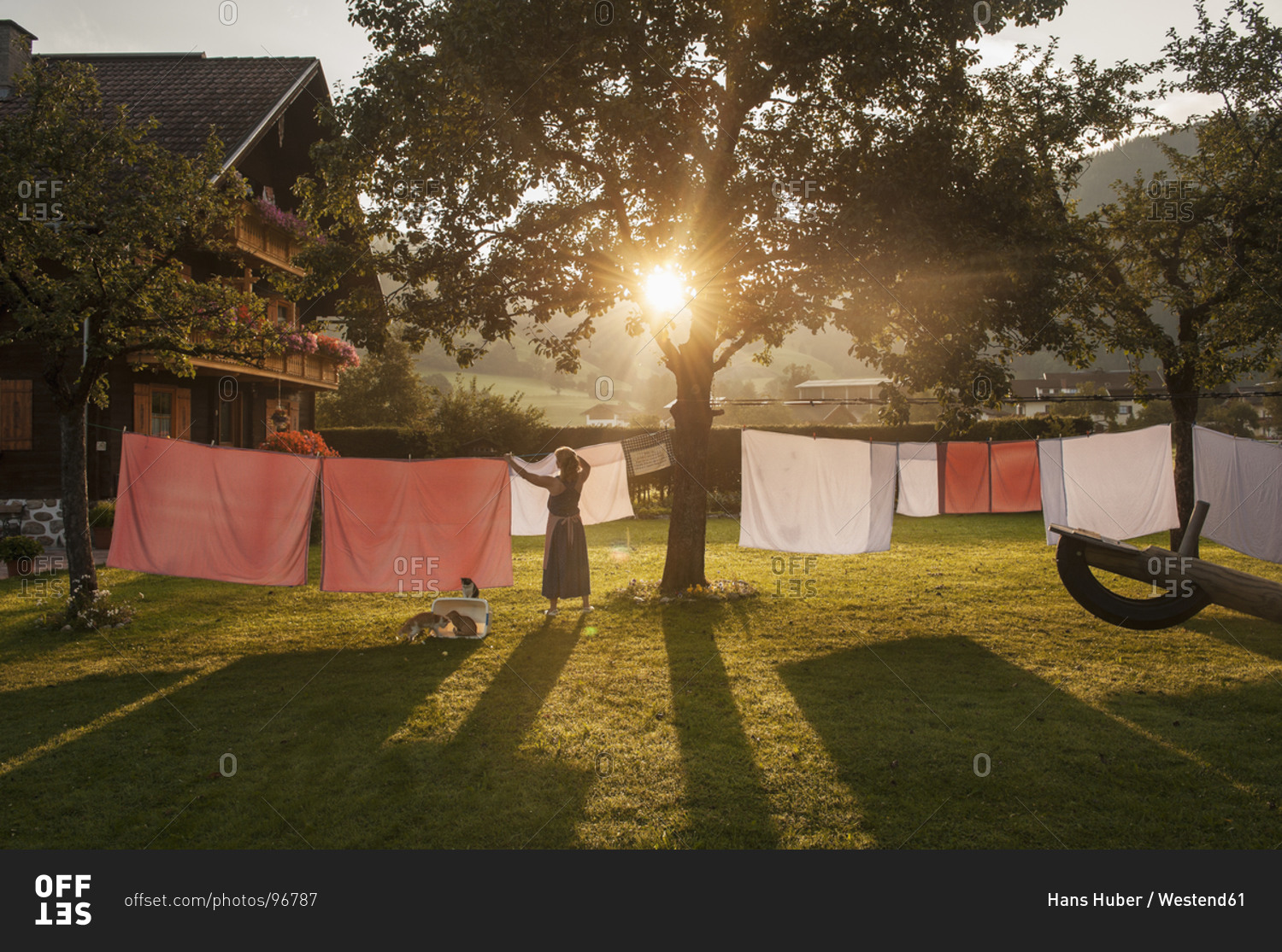 Austria, Radstadt, Farm, Female farmer hangs the washing on the line