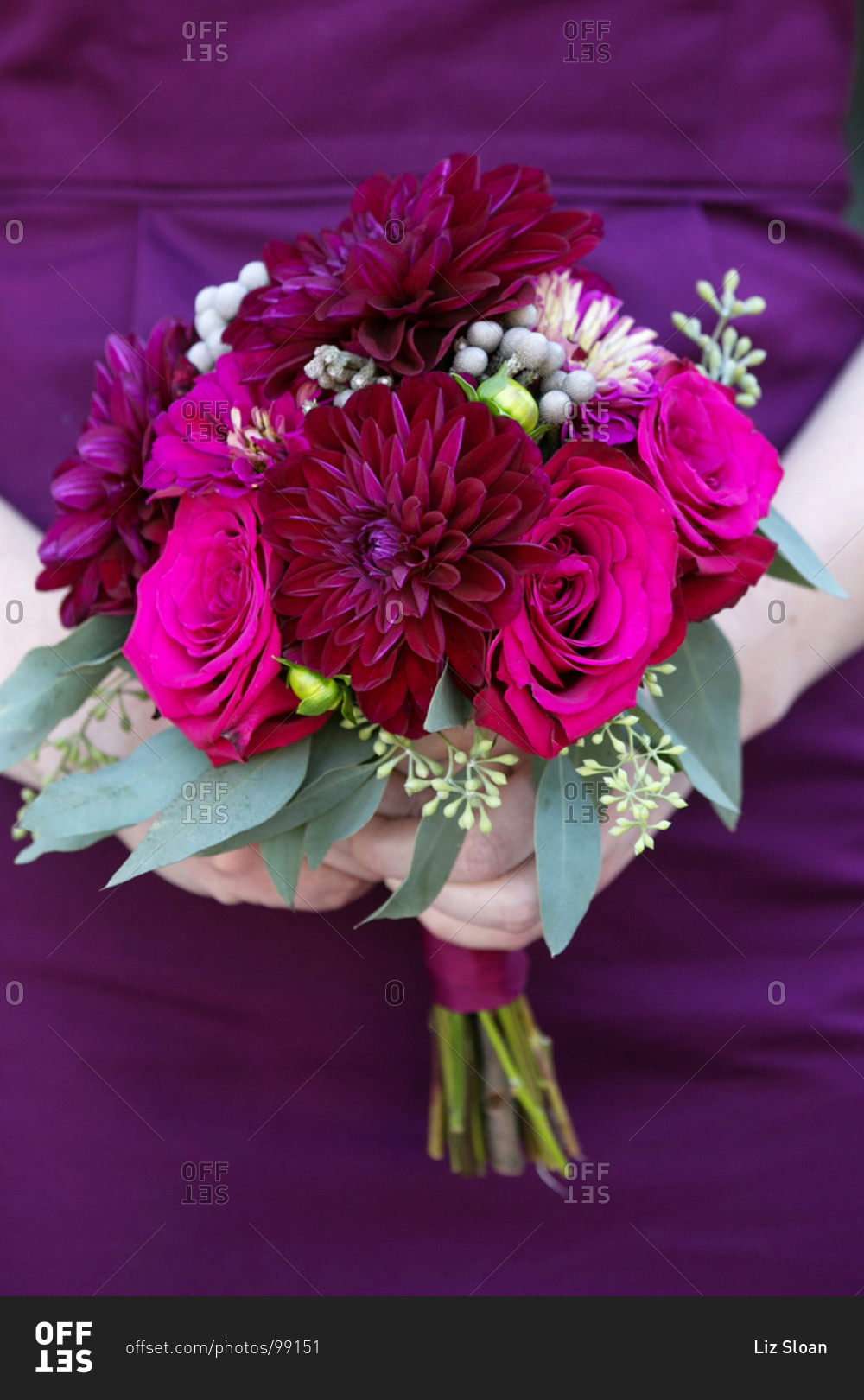 Bridesmaid holding a purple wedding bouquet