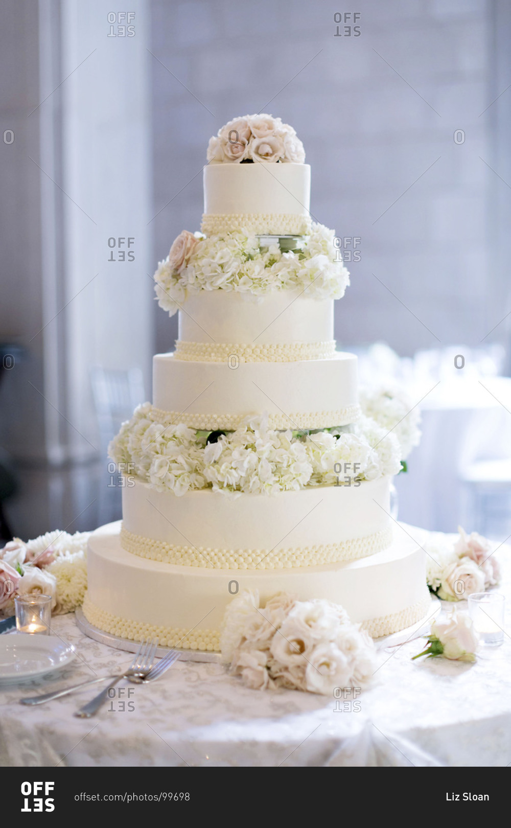 Five-tier wedding cake at wedding reception