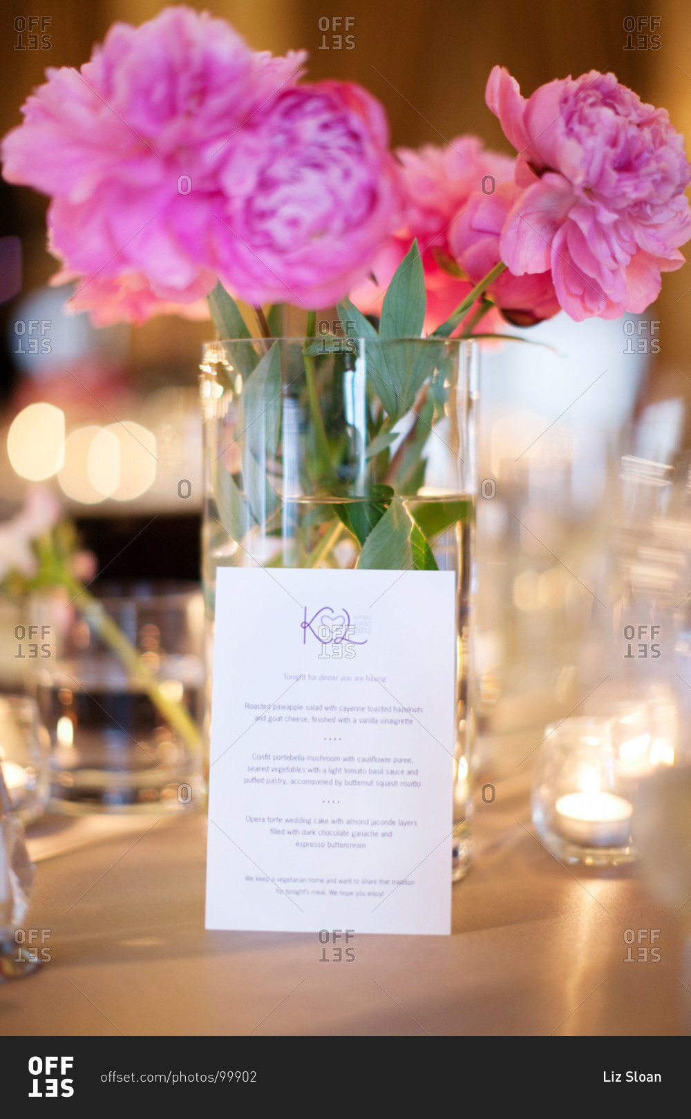 Close up of centerpieces and menu at reception stock photo - OFFSET