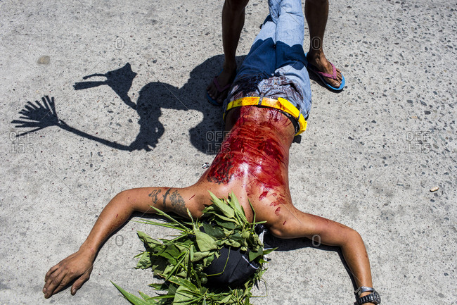 Holy Week in Pampanga province in the Philippines. During the Holy Week festival, many devote Catholics walk the streets whipping themselves and shedding blood to atone for their sins and to ask forgiveness from their God.