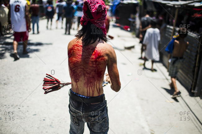 Holy Week in Pampanga province in the Philippines. During the Holy Week festival, many devote Catholics walk the streets whipping themselves and shedding blood to atone for their sins and to ask forgiveness from their God.