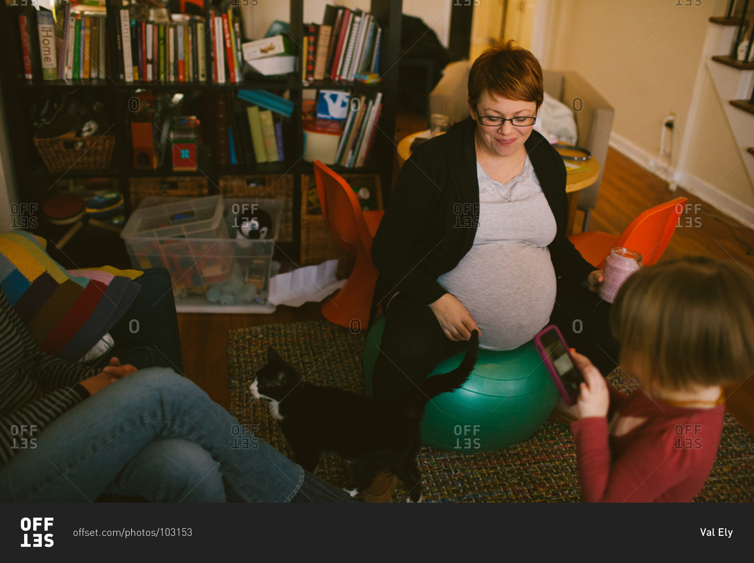 Woman using a birth ball during labor stock photo OFFSET