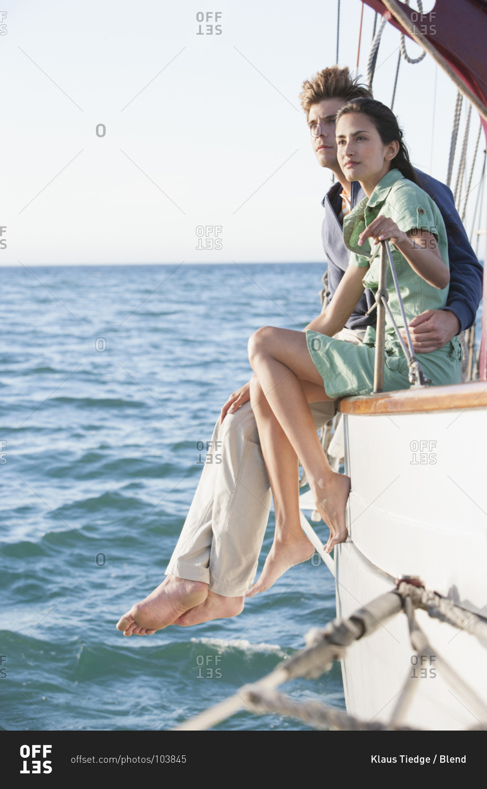 Couple relaxing on sailboat