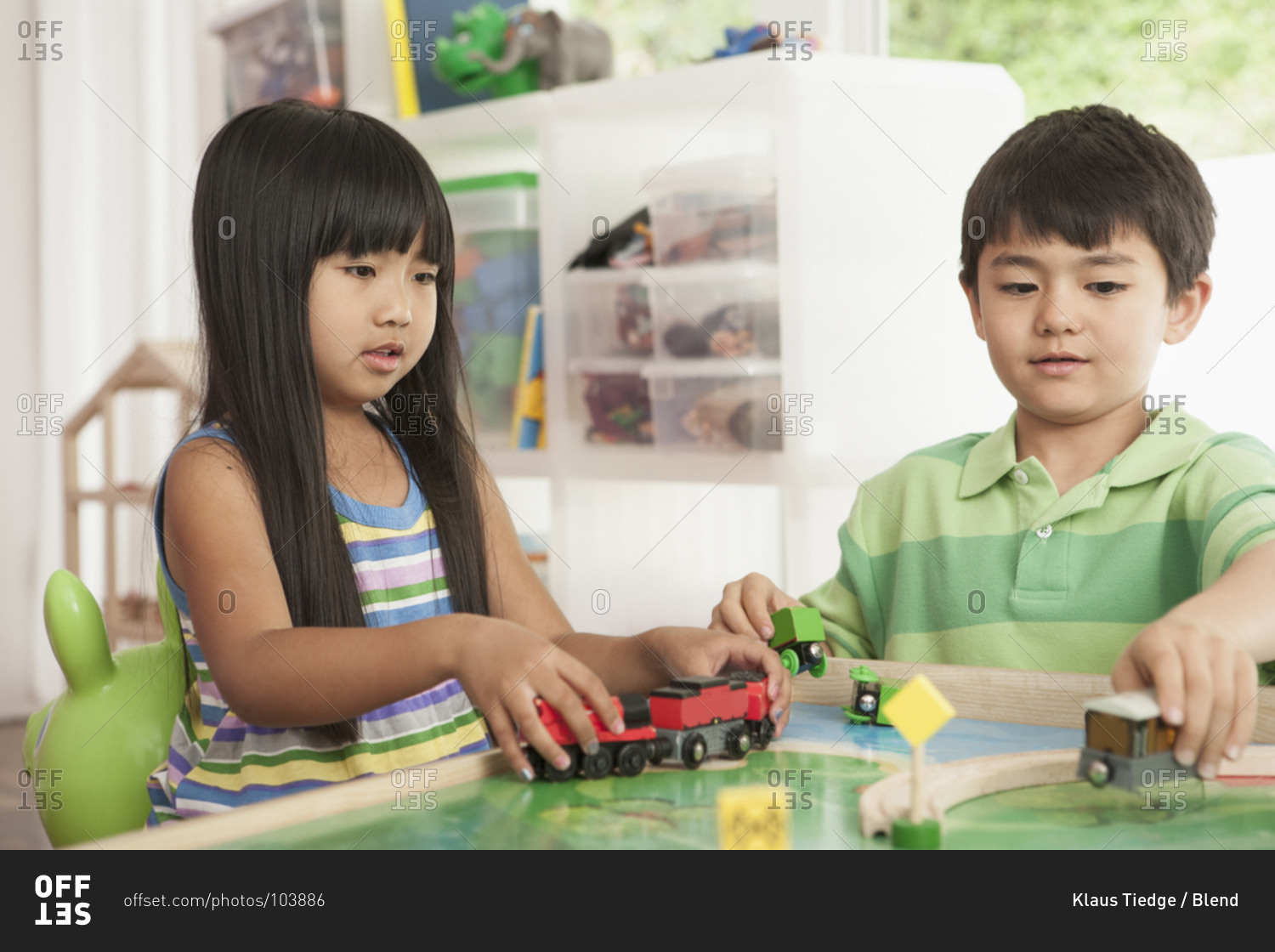 Children playing with train set