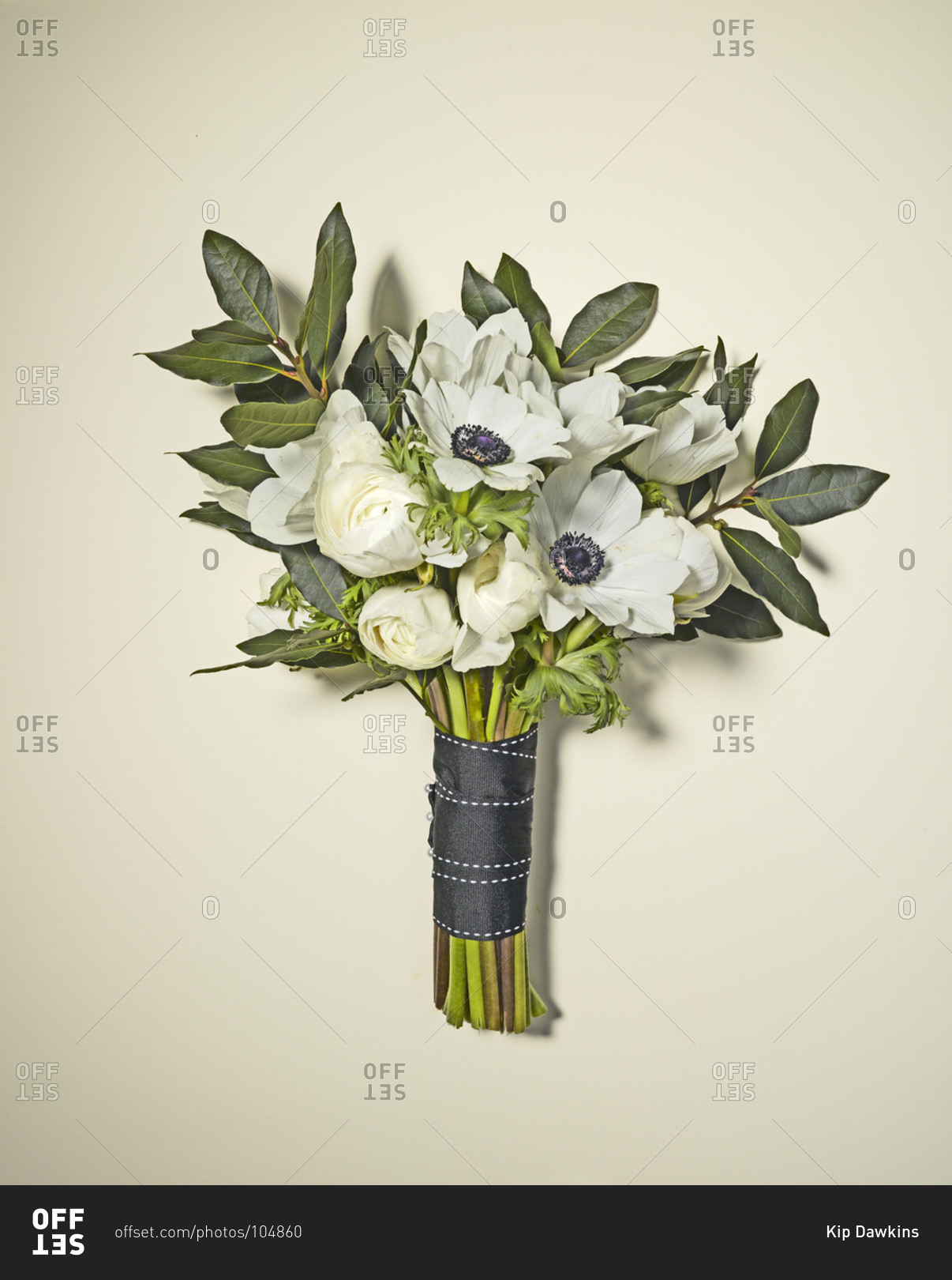 Close up of bridal bouquet of roses and anemone