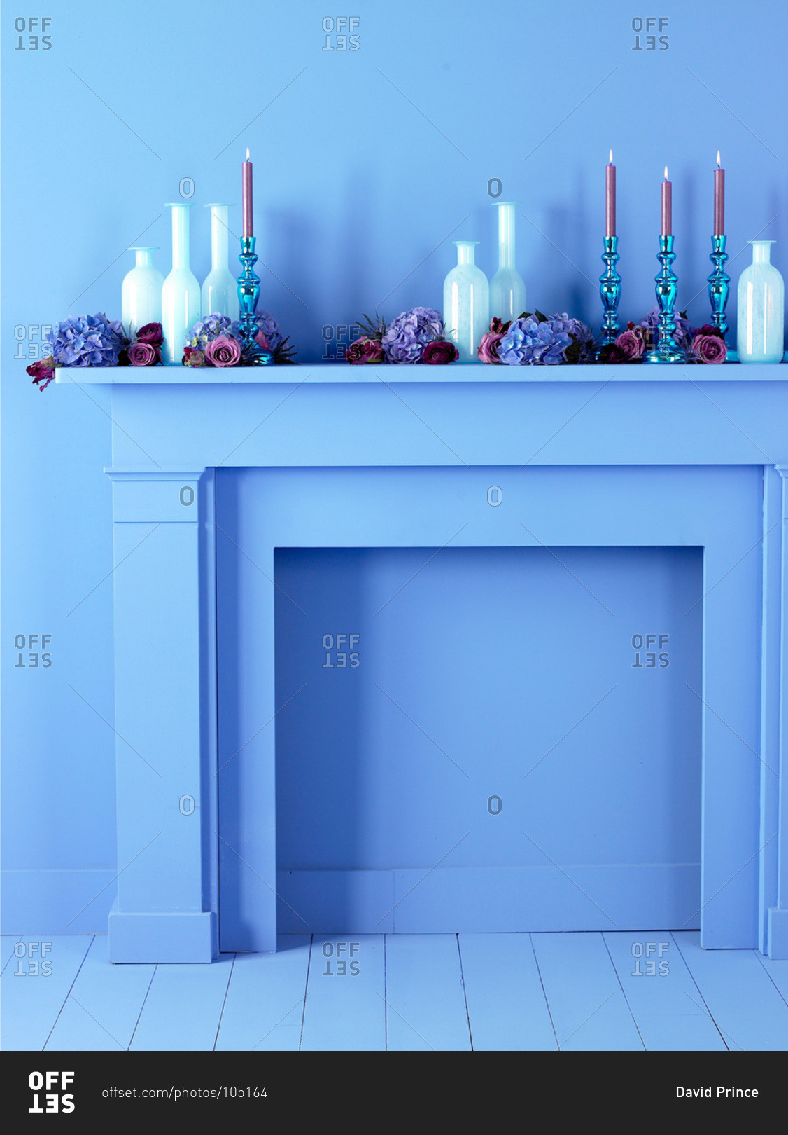 Blue fireplace mantel with decorations
