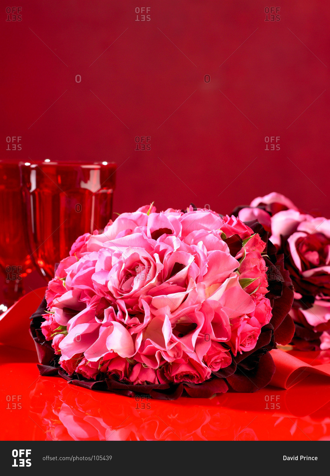 Pink flowers on a red table