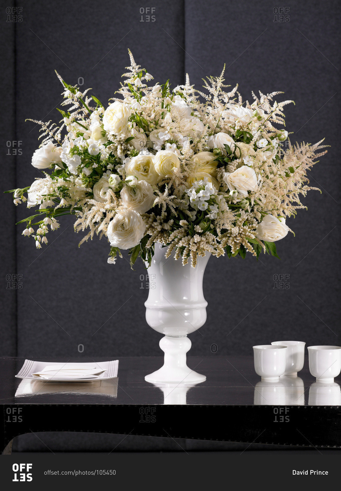 White vase of white flowers