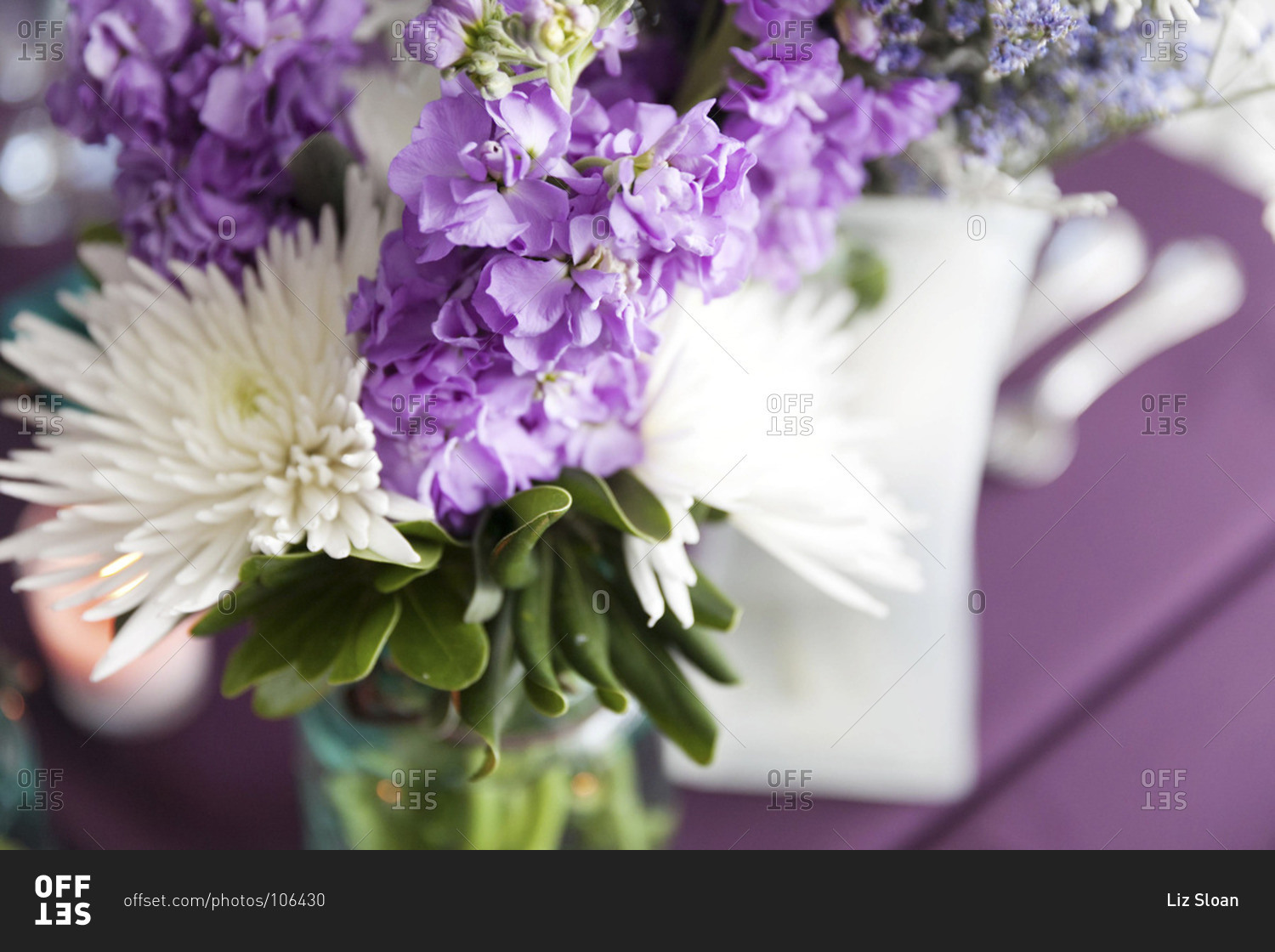 Purple and white flower bouquet at wedding venue