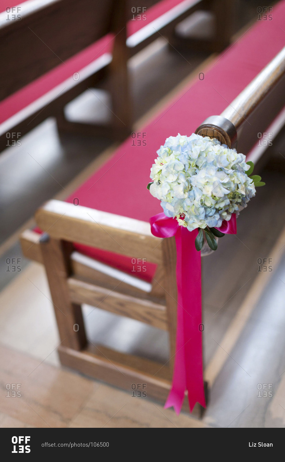 Wedding bouquet on a chapel pew