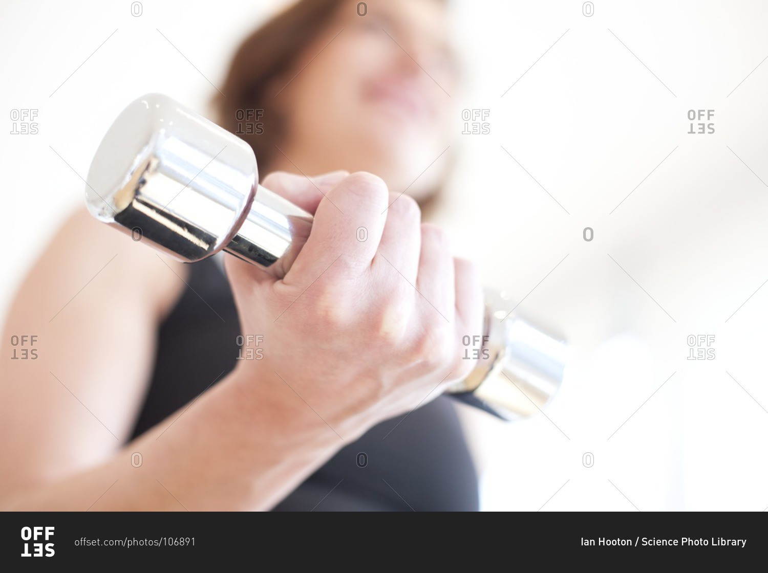 Woman using hand weight