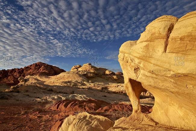 Sandstone arch under clouds, Valley of Fire State Park, Nevada, United States of America, North America