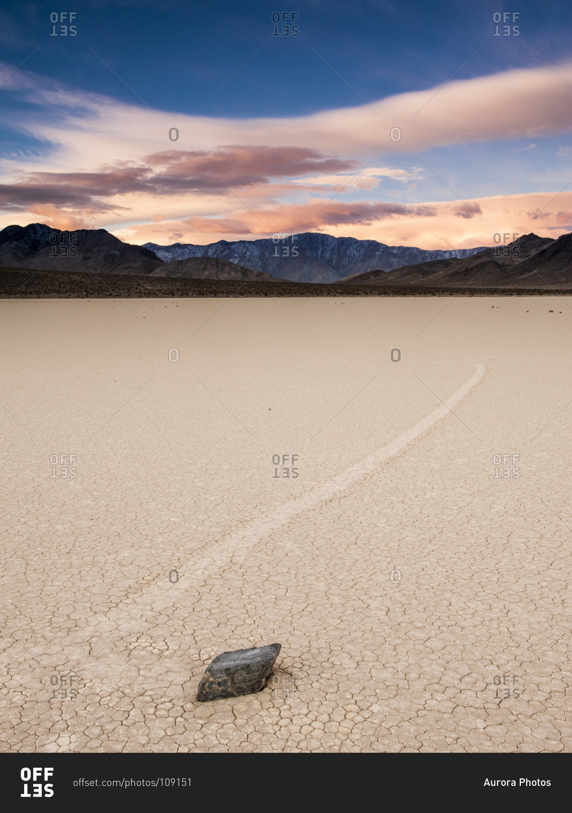 Sunrise above a moving rock at the Race Track, Death Valley National Park