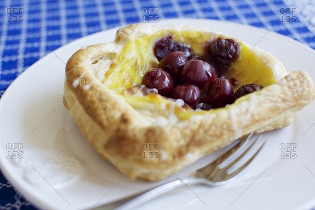 Danish pastry, a viennoiserie pastry with puff pastry, soy pudding and cherries