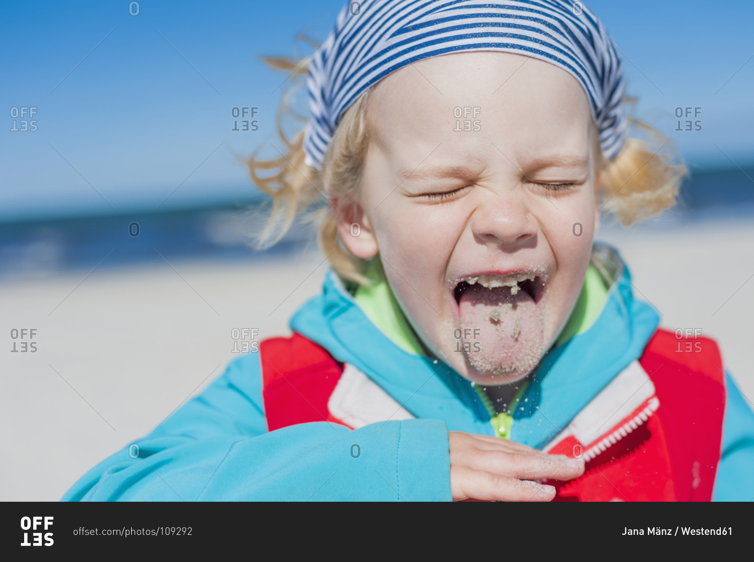 Boy With Sand In Mouth At The Beach Stock Photo - Offset