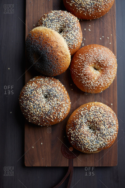 Top view of bagels dusted with coarse sea salt and sesame seeds