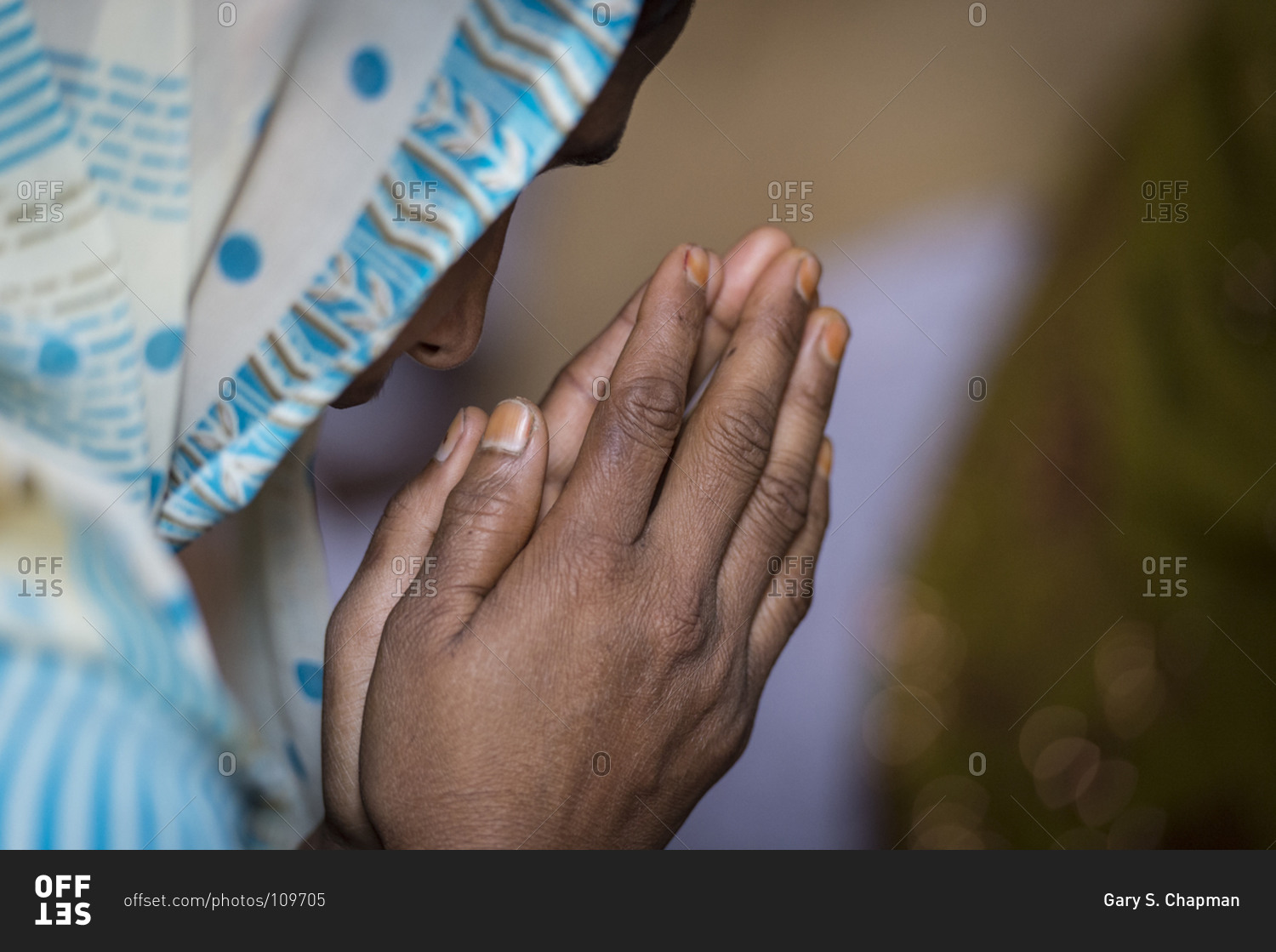 Christian woman praying in India
