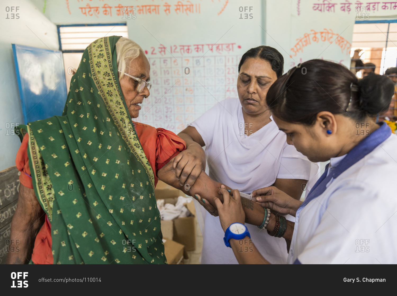 Madhya Pradash, India April 29,2014 Nurses draw blood from a patient