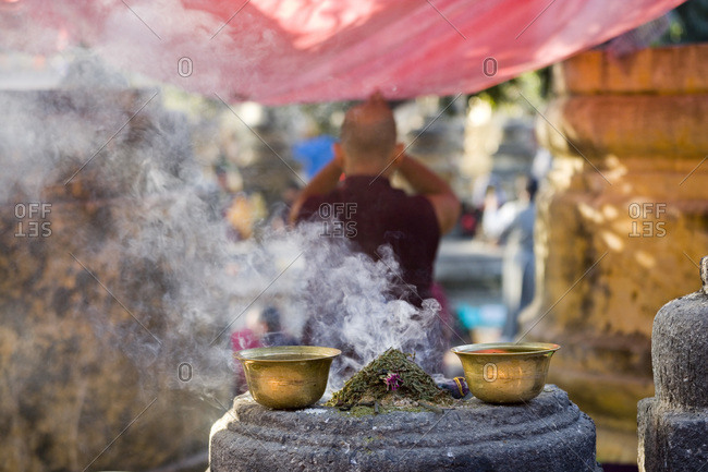 Burning incense at Bodh Gaya Buddhist temple, Gaya, Bihar, India