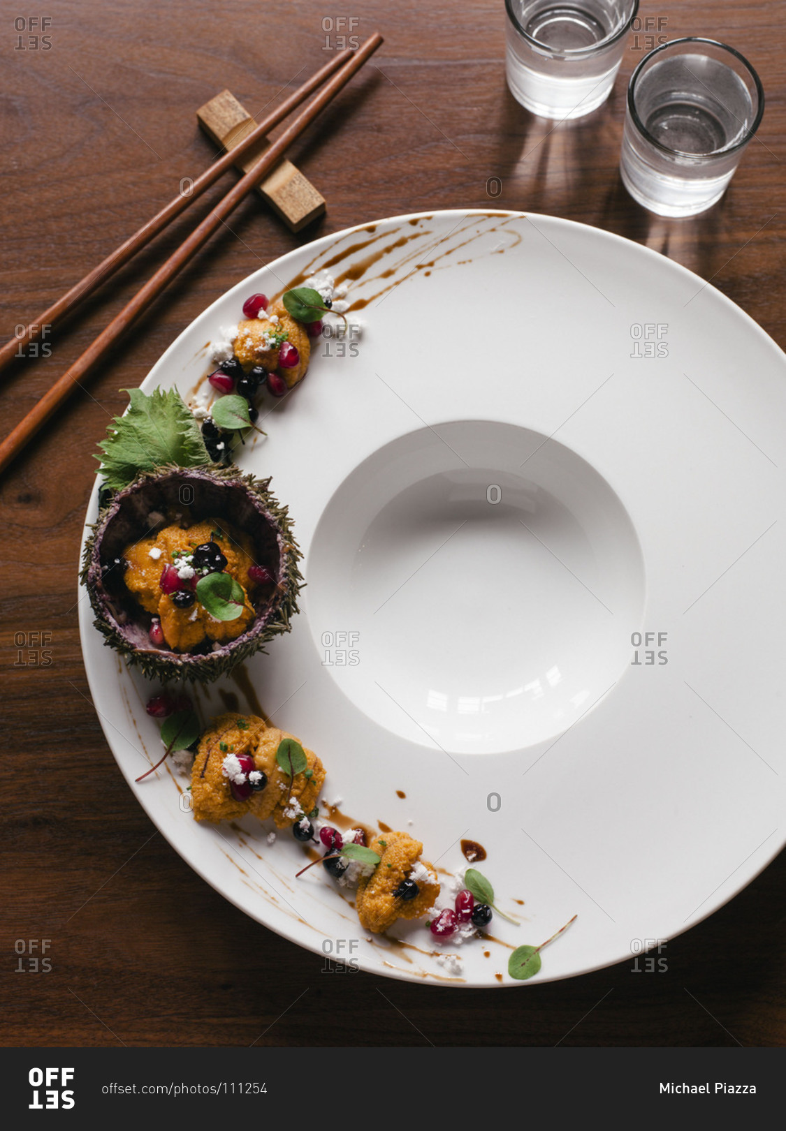 Sea urchin (uni) nigiri on a plate stock photo - OFFSET