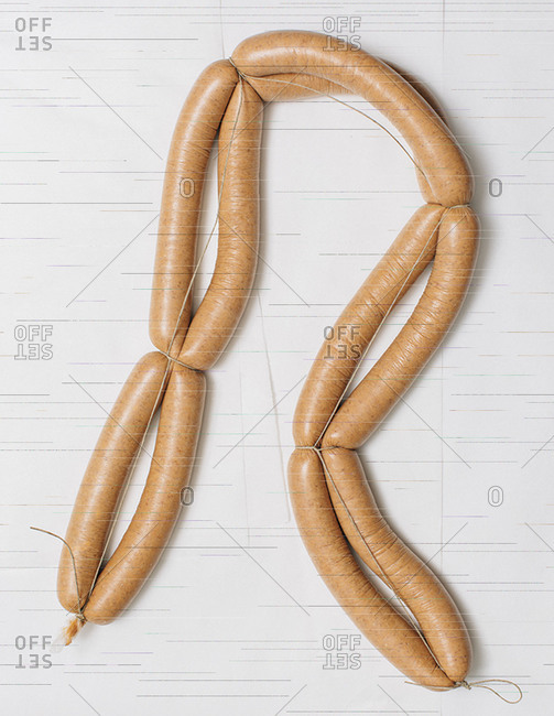 Links of artisanal sausage bound by string