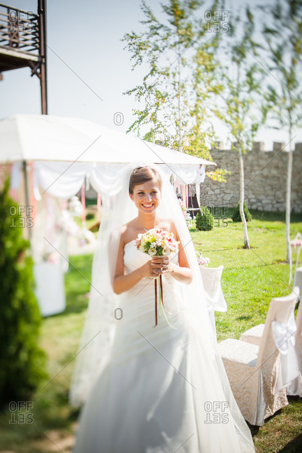 Bride holding a wedding bouquet at a wedding venue