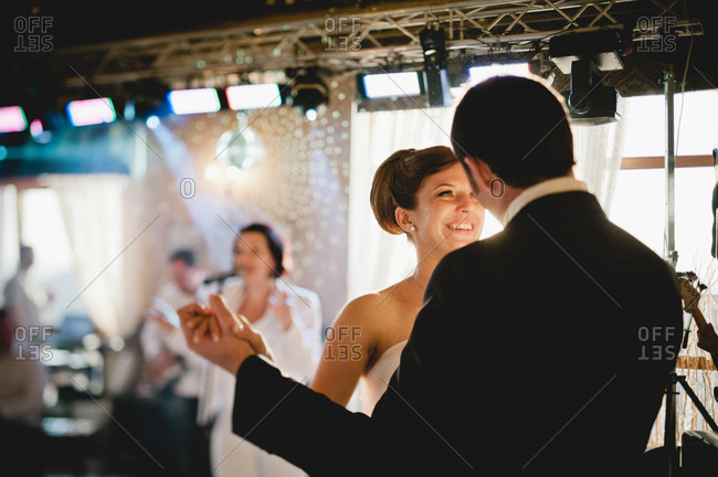 Newly married couple dancing at reception