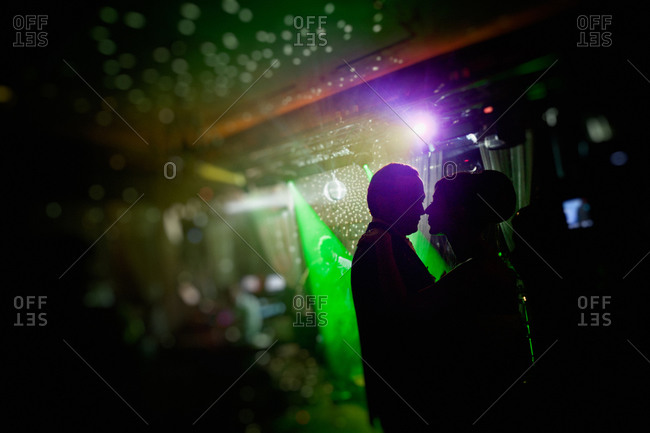 Silhouette of newlywed at wedding reception