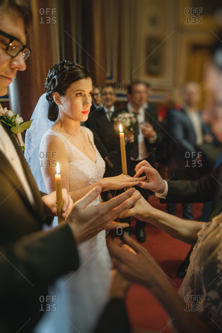 Rings being placed on the couple's fingers during Orthodox ceremony