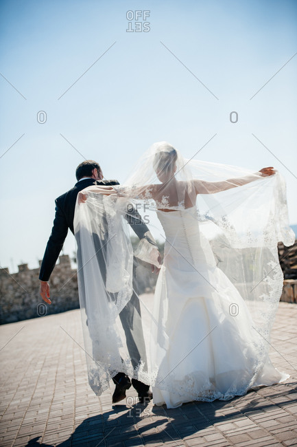 Newlyweds dancing outside