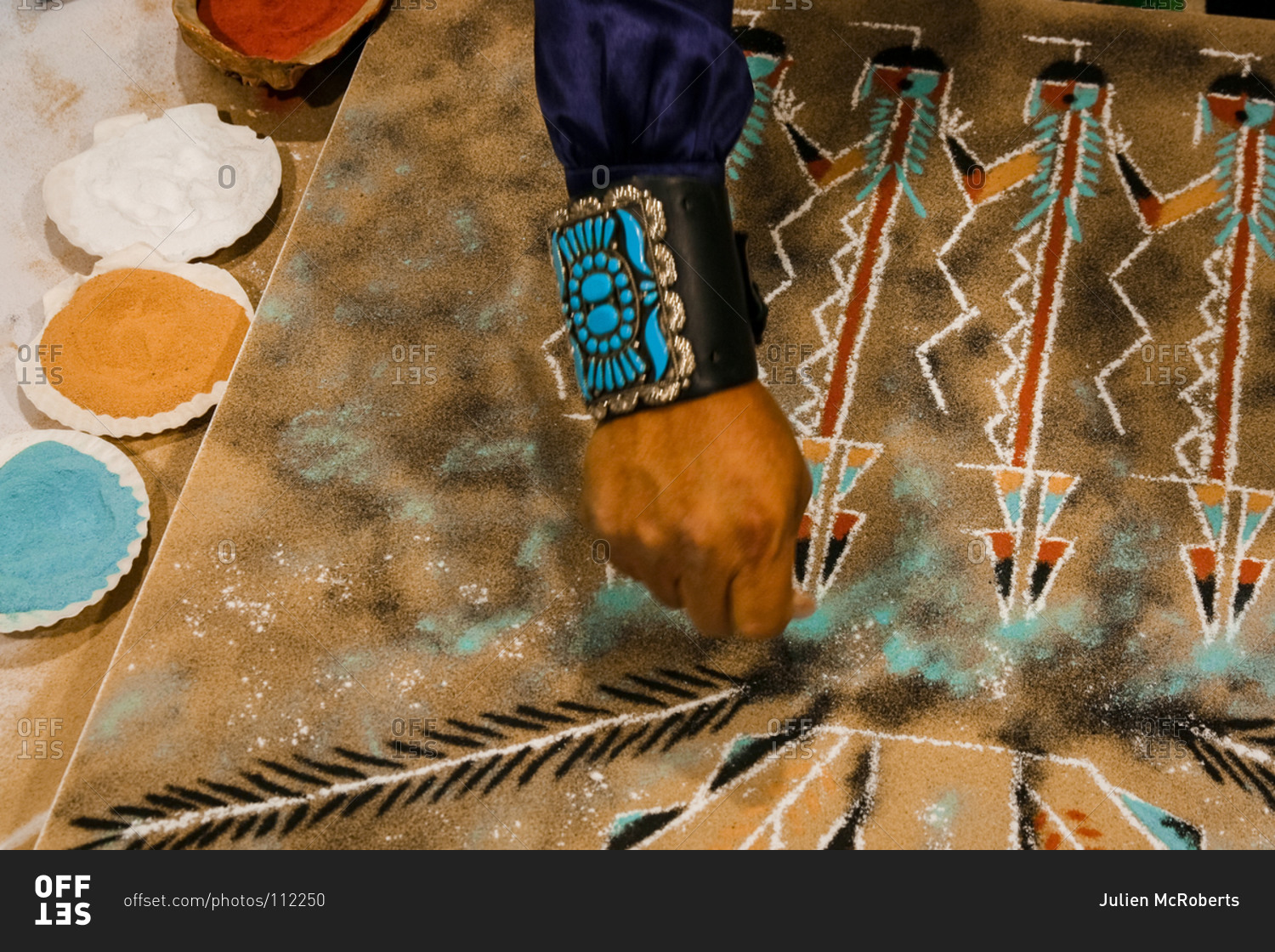 Navajo artist creating a sand painting in Santa Fe, New Mexico, United States stock photo OFFSET
