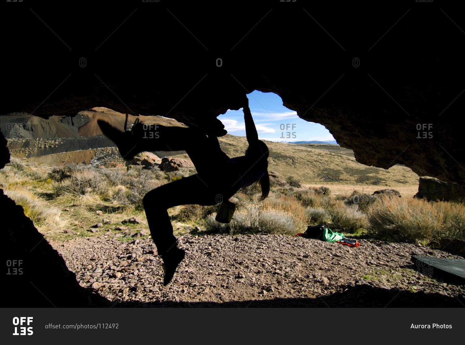 A silhouette of a woman bouldering in Washoe Valley, Nevada