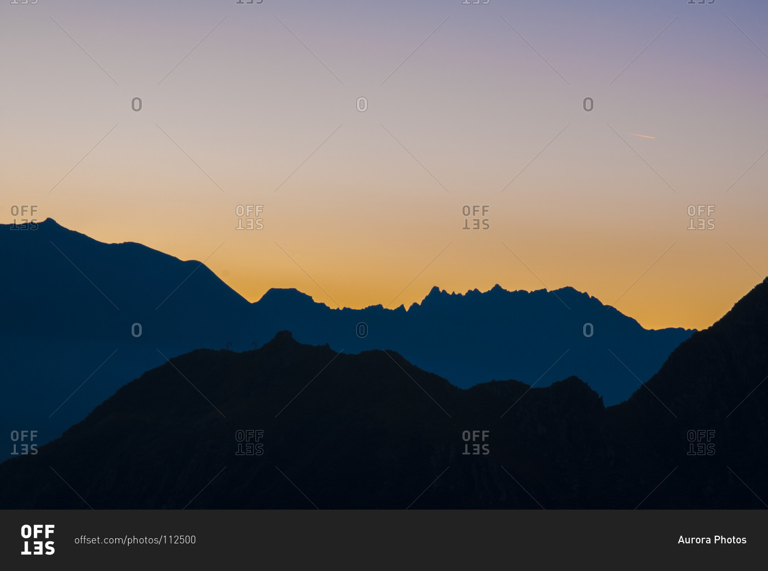 Silhouette of mountains at sunrise with colorful sky, Ossola, Italy