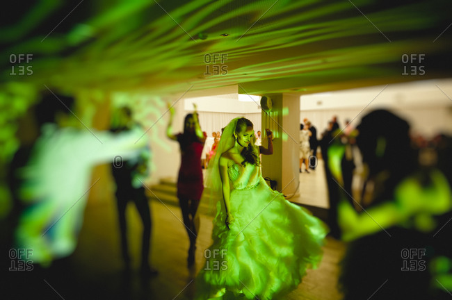 Newlywed wife dancing at the wedding reception